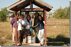 Our group posing with the well and pump donated by our friends and clients from previous trips