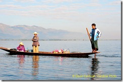 "Intha Style" boats are family cars for the villagers living on Inle Lake. Here the father takes his daughter to school and his wife to market before beginning his day fishing.