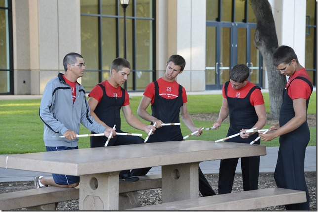 This candid, shot at ISO 3200, of an ad hoc warmup on a concrete picnic table was only possible because of the Nikon D4’s low-light capability. 