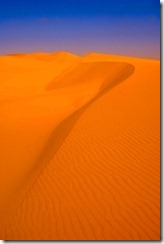 Freeman deals with difficult topics like using shapes, lighting and leading the viewer's eye into the image as typified by this Namibian Sand Dune Photo. Image Copyright David Cardinal.